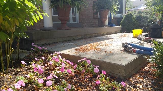 Sinking Front Patio & Foundation Water Intrusion Repair in Mississauga, Ontario - Before Photo