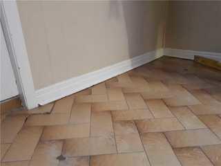 Trip Hazard and Separating Bricks Due to Sinking Floor, Toronto, ON