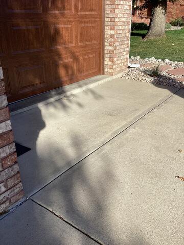Driveway into Garage Concrete Lift - Before Photo