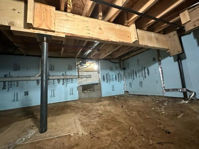 Sagging Floor in Luna Pier, MI Stabilized with Crawl Space Support - Before Photo
