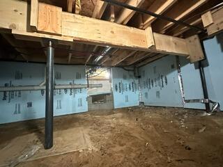 Sagging Floor in Luna Pier, MI Stabilized with Crawl Space Support