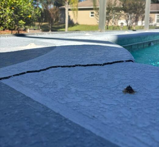 Concrete Pool Deck Leveling and Repair in Sanford, FL - Before Photo