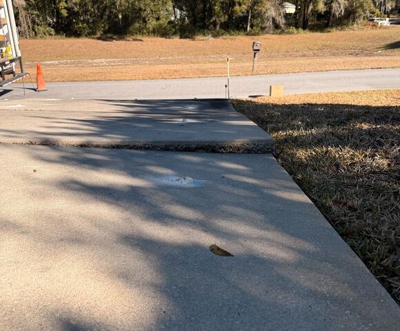 Concrete Driveway Trip Hazard Removed in Dunnellon, FL - Before Photo