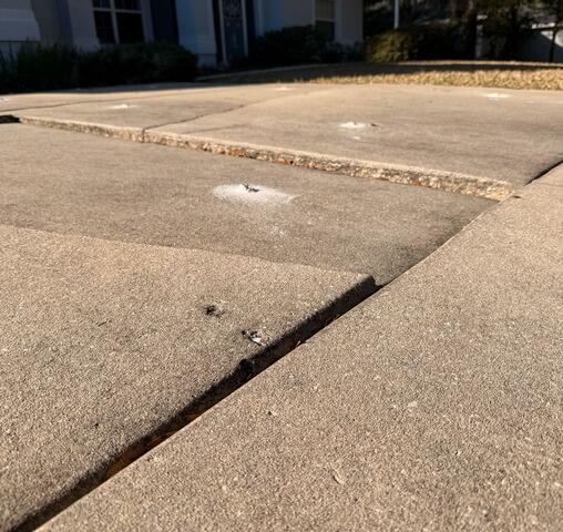Concrete Driveway Repair and Leveling in Dunnellon, FL - Before Photo