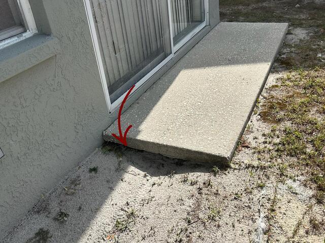 Void Filled Beneath Concrete Slab in Tampa, FL - Before Photo