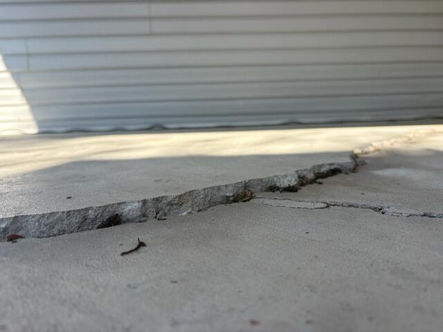 Concrete Carport Slab Leveling and Repair in Zephyrhills, FL - Before Photo