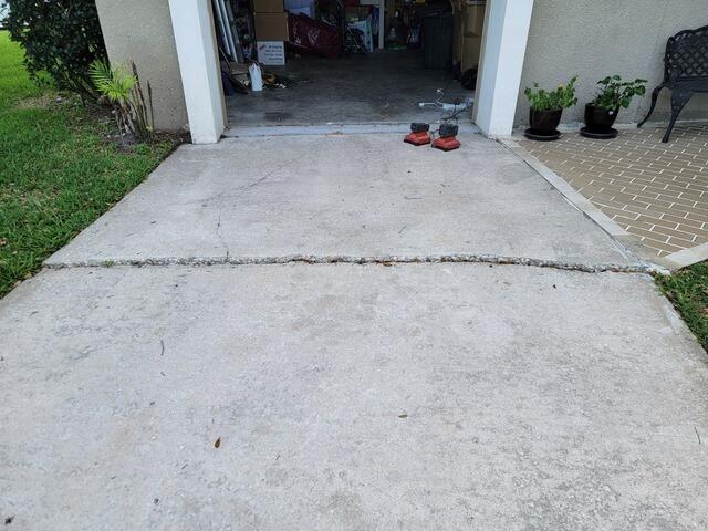 Concrete Driveway Trip Hazard Repaired in Kissimmee, FL