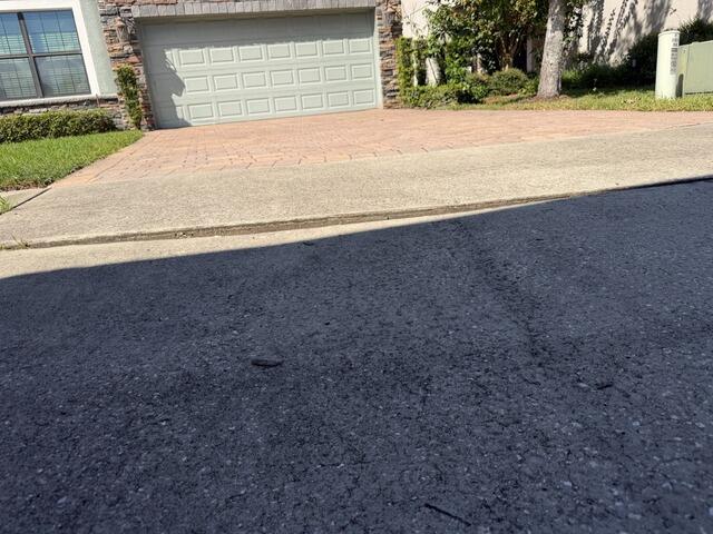 Concrete Driveway Leveling & Trip Hazard Repair in Orlando, FL - Before Photo