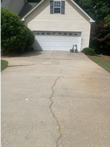 Driveway Leveling Transformation in Carrollton, Georgia - Before Photo