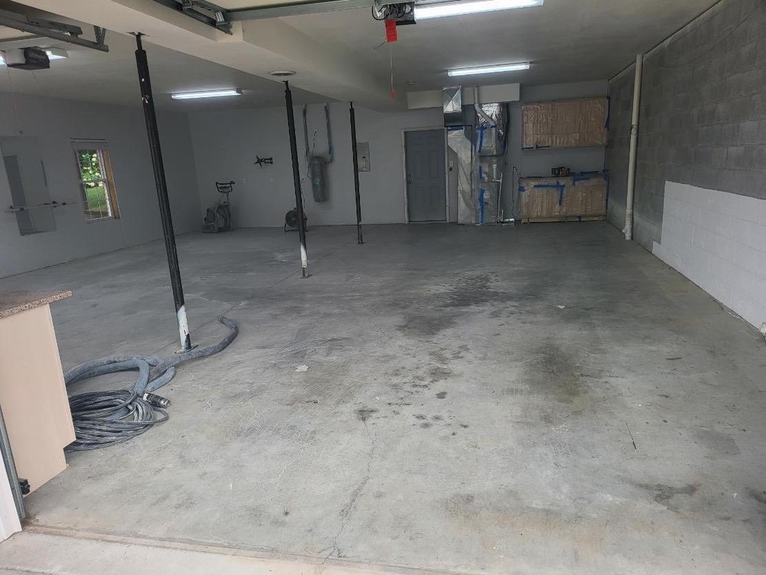 Hello Garage of Knoxville Before & After Photo Set New Polyaspartic Garage Floor Coating in