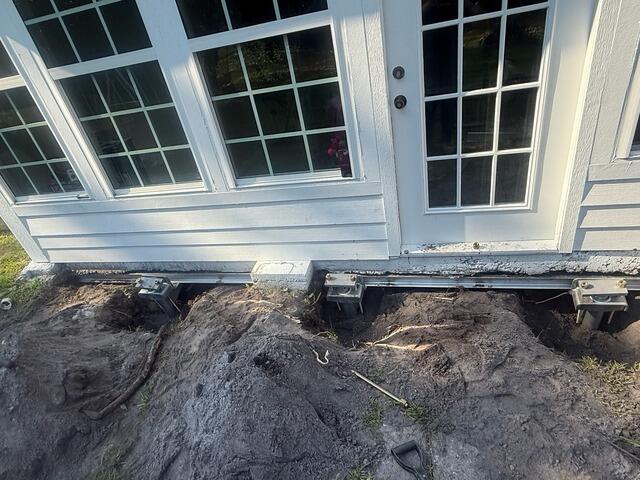 Helical Pier Installation for Foundation Repair - Jacksonville, FL - Before Photo