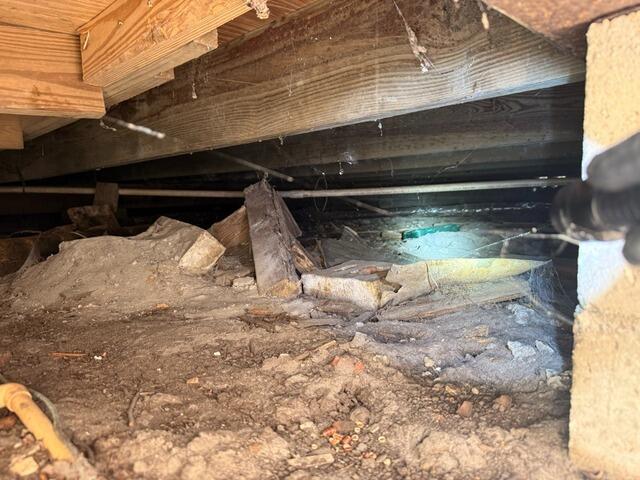 Sagging Floors & Moisture Issues Fixed with SmartJacks and Vapor Barrier Installation - Before Photo