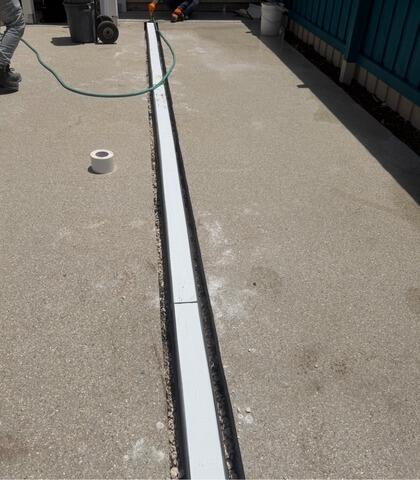 Trench Drain Installation Protects Jacksonville Beach, FL Home from Surface Water Intrusion - Before Photo
