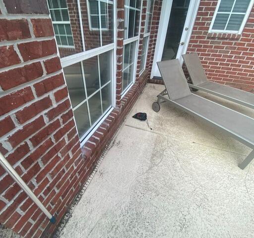 New Channel Drain Installation Protects Patio from Pool Water Damage in St. Johns, FL - Before Photo