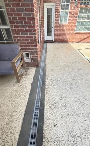 New Channel Drain Installation Protects Patio from Pool Water Damage in St. Johns, FL - After Photo