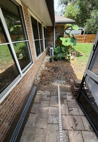 Exterior Drainage Installation for Enclosed Patio Water Intrusion in Jacksonville, FL - After Photo