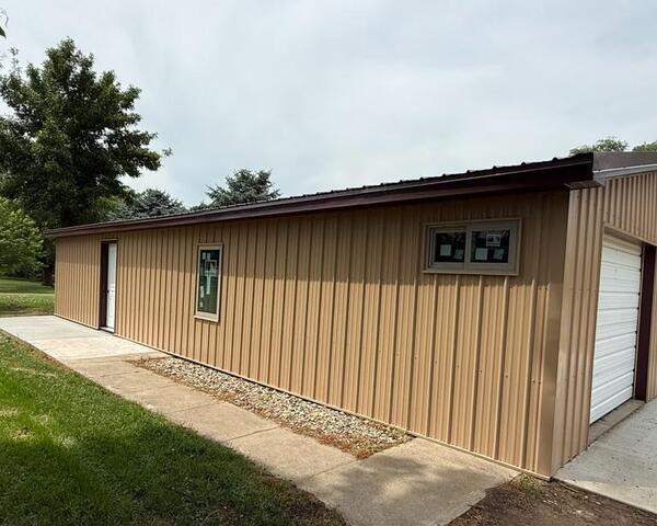 Shed getting Debris sheeding Gutter System in Wolsey SD - Before Photo