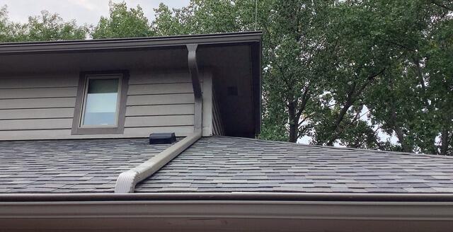 Gutter re-slope and new downspout - After Photo