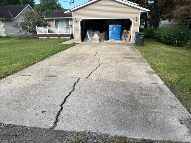 Repairing a cracked driveway in North Ridgeville, OH. - Before Photo