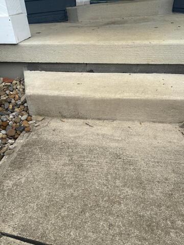 Leveling a porch step in Willard, OH. - Before Photo