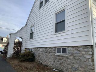 Radon Mitigation System Installed in Fieldstone Home in Waterbury (Exterior)
