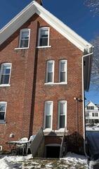 Two-Pipe Radon Mitigation System Installed with Sump Cover in Ansonia Home