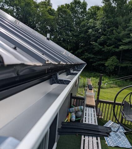 Seamless Gutter Installation in Black River, NY - Before Photo
