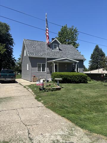 New Roof with 50 year no leak transferable warranty, new siding, and gutters - After Photo