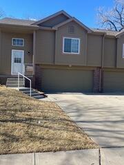 Replace damaged drip edge on roof and upgrade downspouts