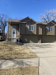 Replace damaged drip edge on roof and upgrade downspouts