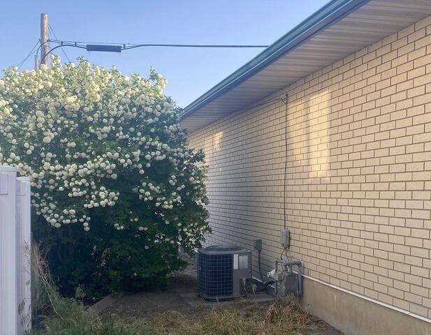 Seamless Gutter Upgrade Protects Sidewall in American Fork - Before Photo