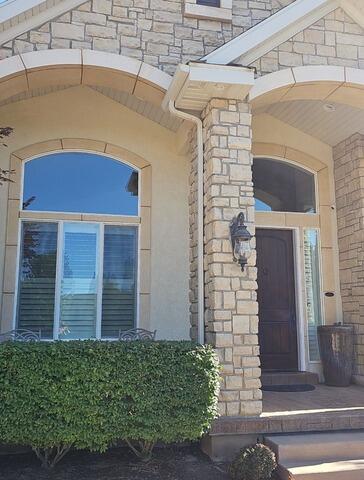 Seamless Brown Gutters Elevate Draper Home's Entryway - Before Photo