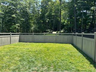 Eye-catching Cypress Woodgrain Vinyl Fence in Portland, CT