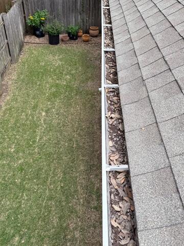 Dirty Clogged Gutters Cleaning in Austin, TX - Before Photo