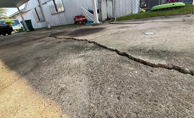 Lifting, Leveling and Sealing a Cracked Patio in Avondale, LA! - Before Photo