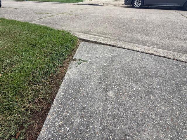 Raising Sinking Concrete in Metairie, LA! - Before Photo