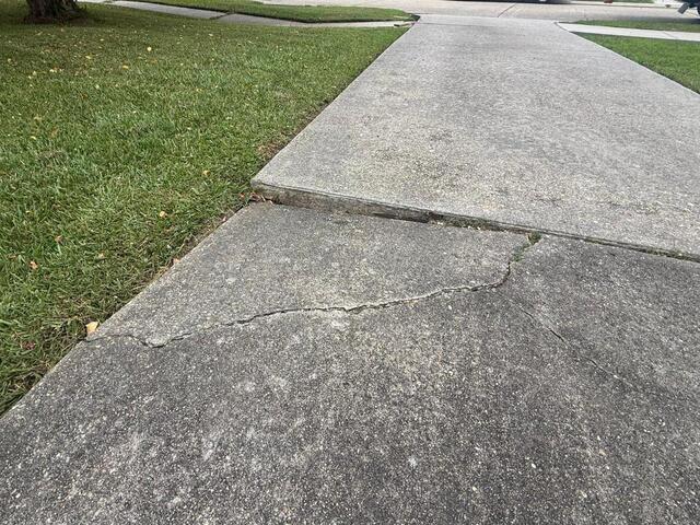 Lifting and Leveling a Sinking Driveway in Metairie, LA! - Before Photo
