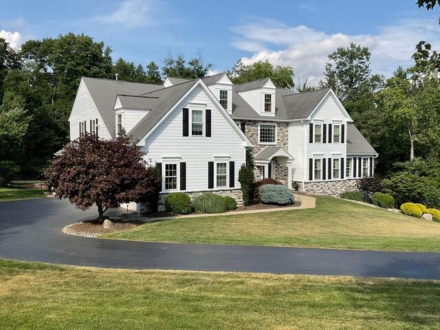 Ambler Home Transformation: New Siding, Windows & Stucco Remediation