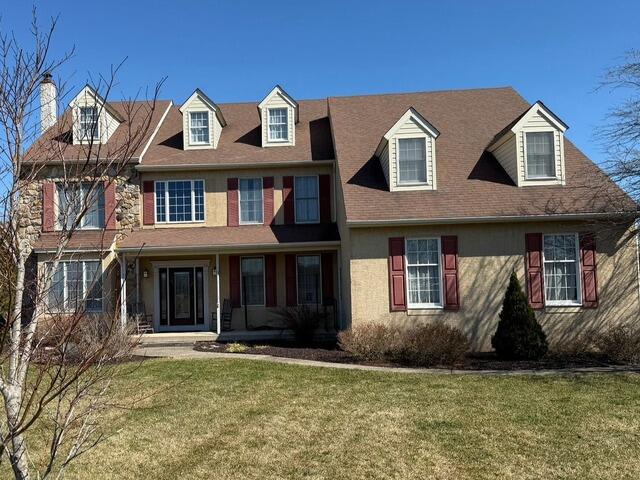 A Durable Upgrade: From Stucco to James Hardie in Schwenksville - Before Photo