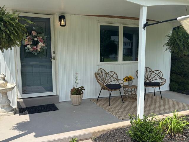 From an Oversized Bow Window to a Seamless Exterior Transformation - After Photo