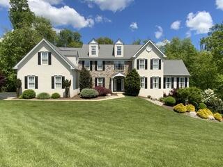 Ambler Home Transformation: New Siding, Windows & Stucco Remediation