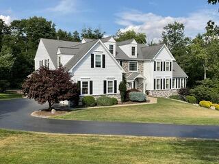 Ambler Home Transformation: New Siding, Windows & Stucco Remediation