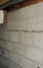 The picture shows foundation walls beginning to bow.
