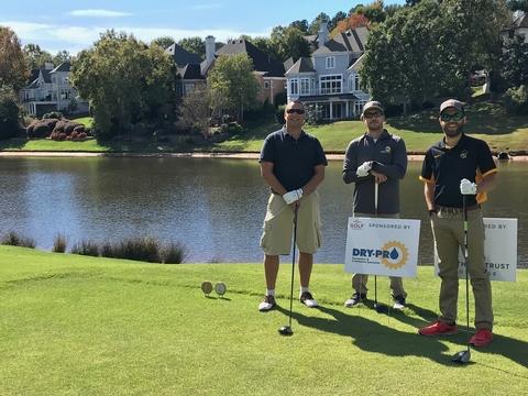 The picture shows the Dry Pro team in attendance at the charity golf tournament.