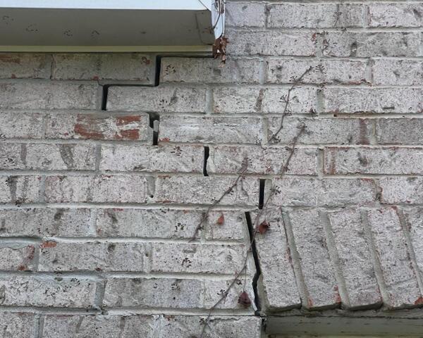 Stairstepping cracks in outside brick.