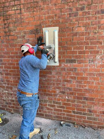 Man installing GeoLock Anchors.