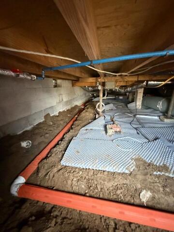 Crawl space drainage pipes