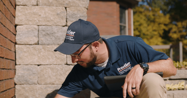 Man conducting a foundation inspection. 