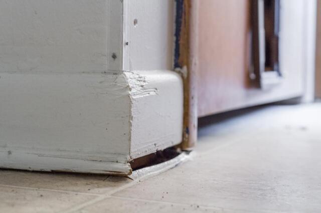 Floor sagging away from baseboard