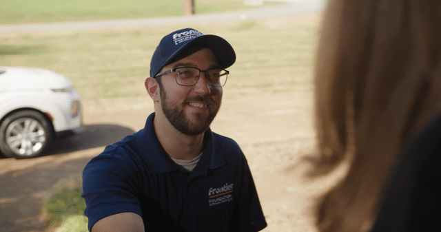 Design Specialist greeting a customer.